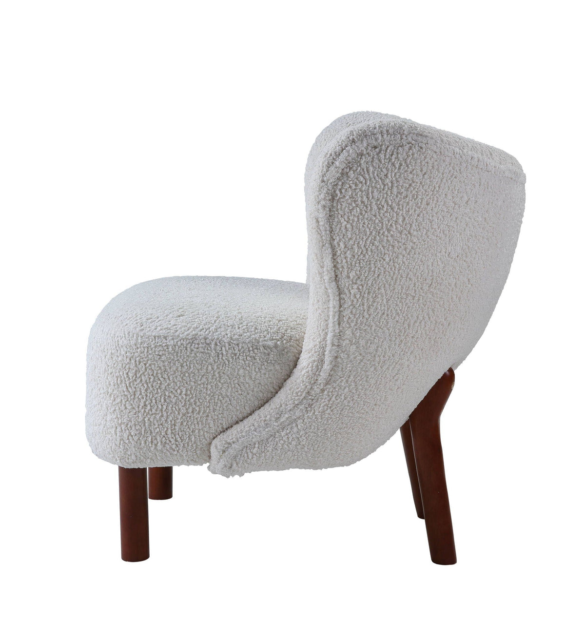 White sherpa accent chair viewed from the side against a plain background