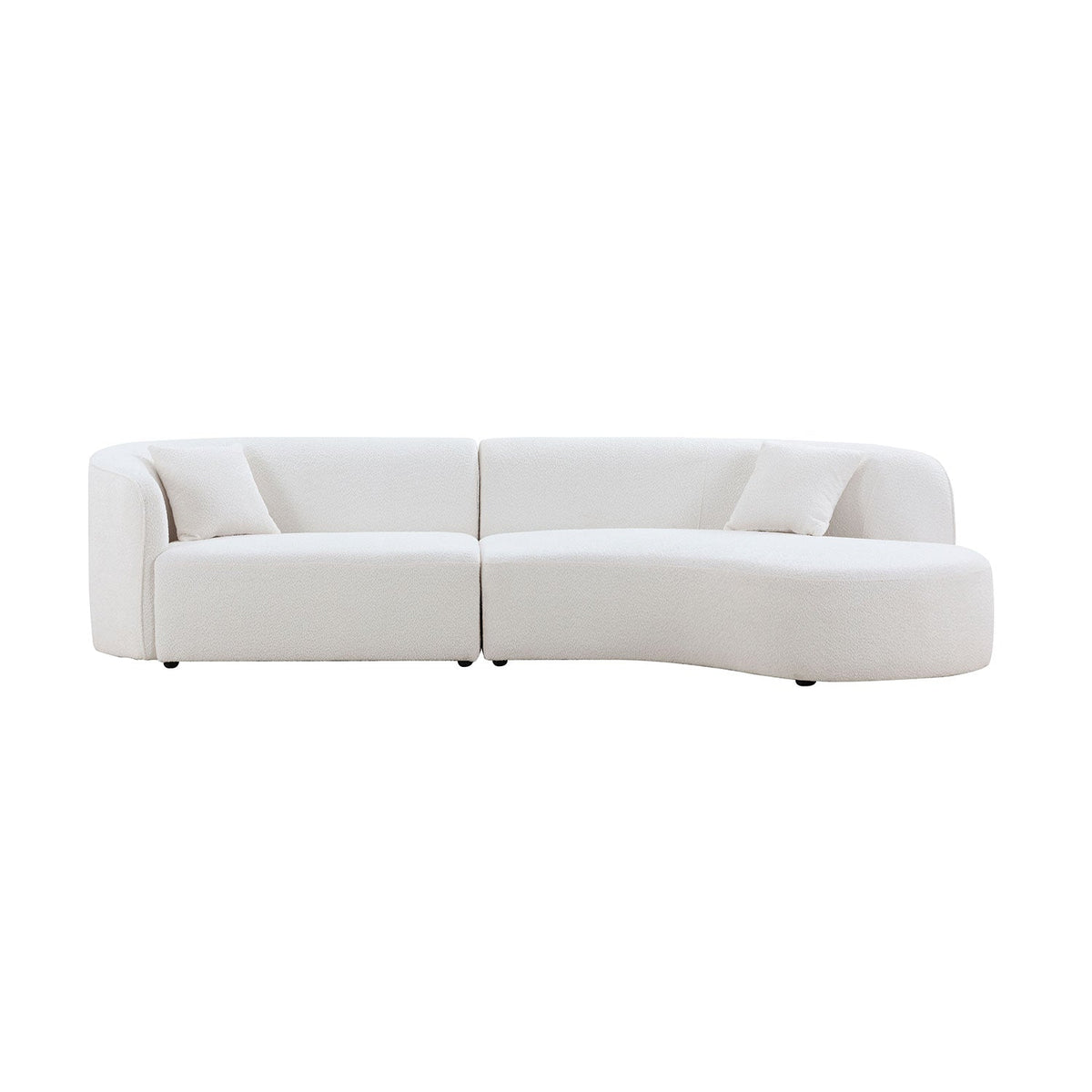 Curved sofa with chaise styled in a living room