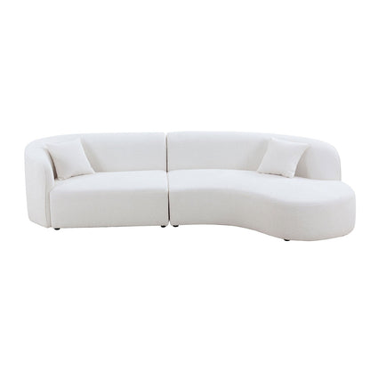 Curved sofa with chaise in boucle fabric upholstery