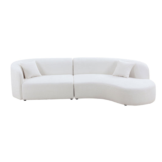 Curved sofa with chaise in boucle fabric upholstery