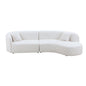 Curved sofa with chaise in boucle fabric upholstery