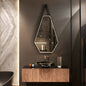 Irregular LED bathroom mirror mounted above vanity