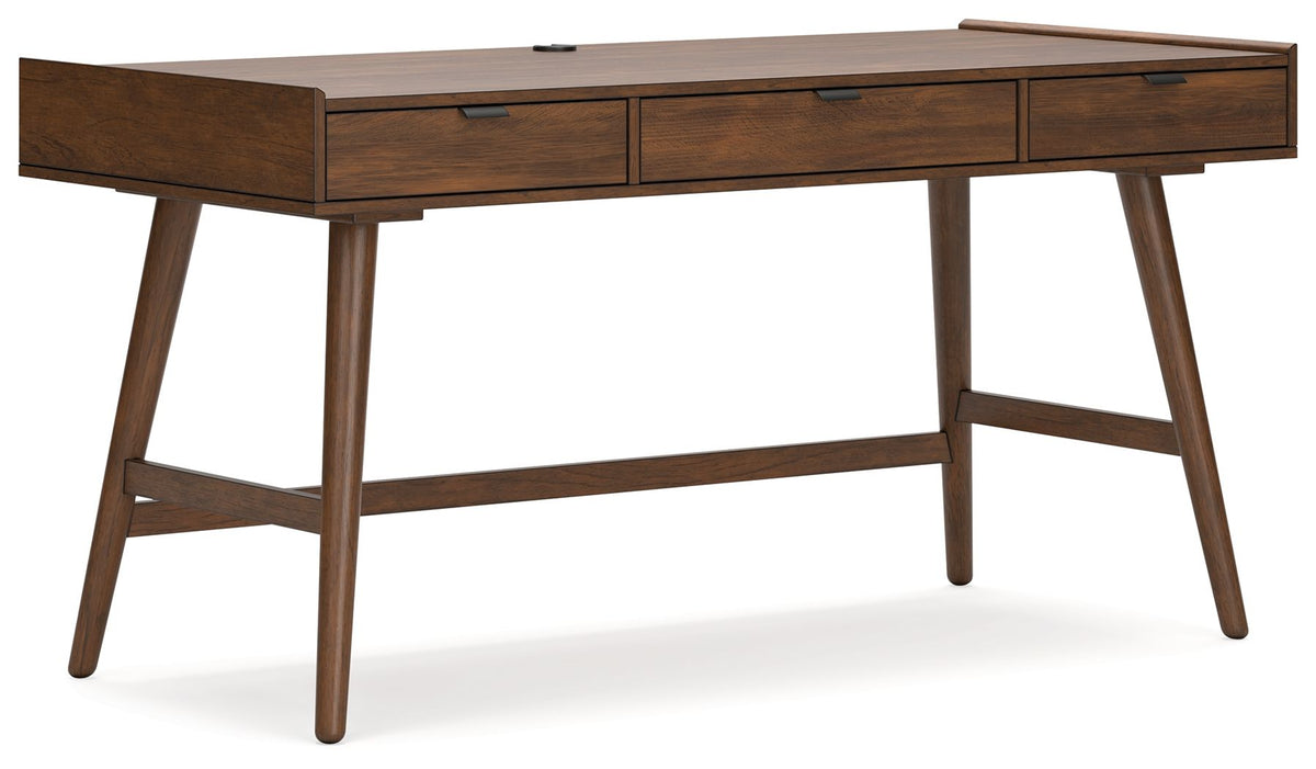 Close view of a drawer front and tapered wood leg