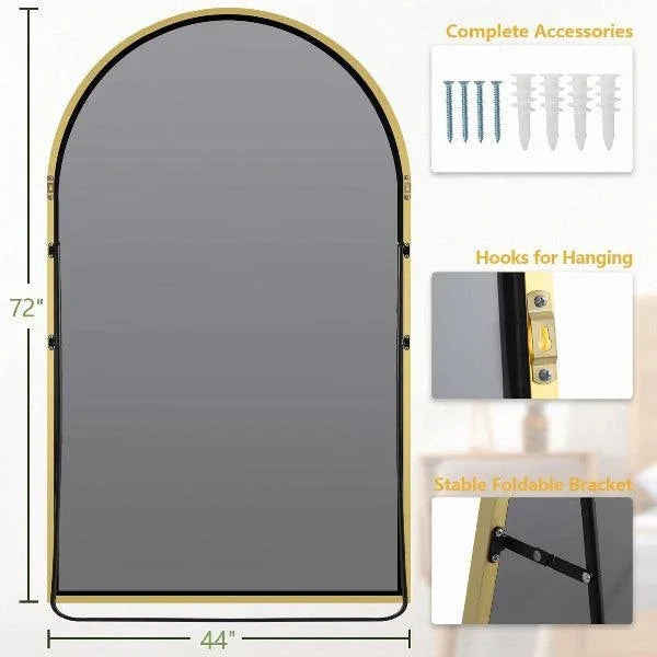 Gold aluminum frame detail on arched floor mirror