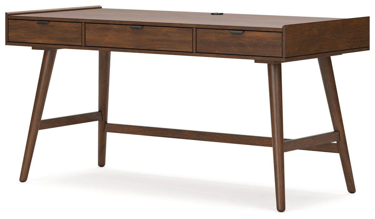 Light brown desk viewed from the side against a plain background