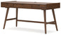 Light brown desk viewed from the side against a plain background