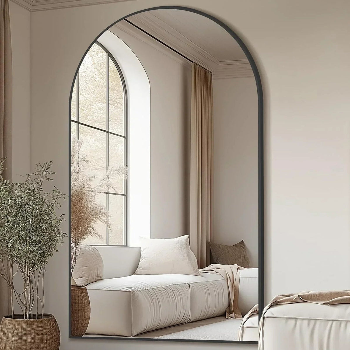 Arched floor mirror leaning against living room wall