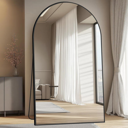 Black aluminum frame detail on arched floor mirror