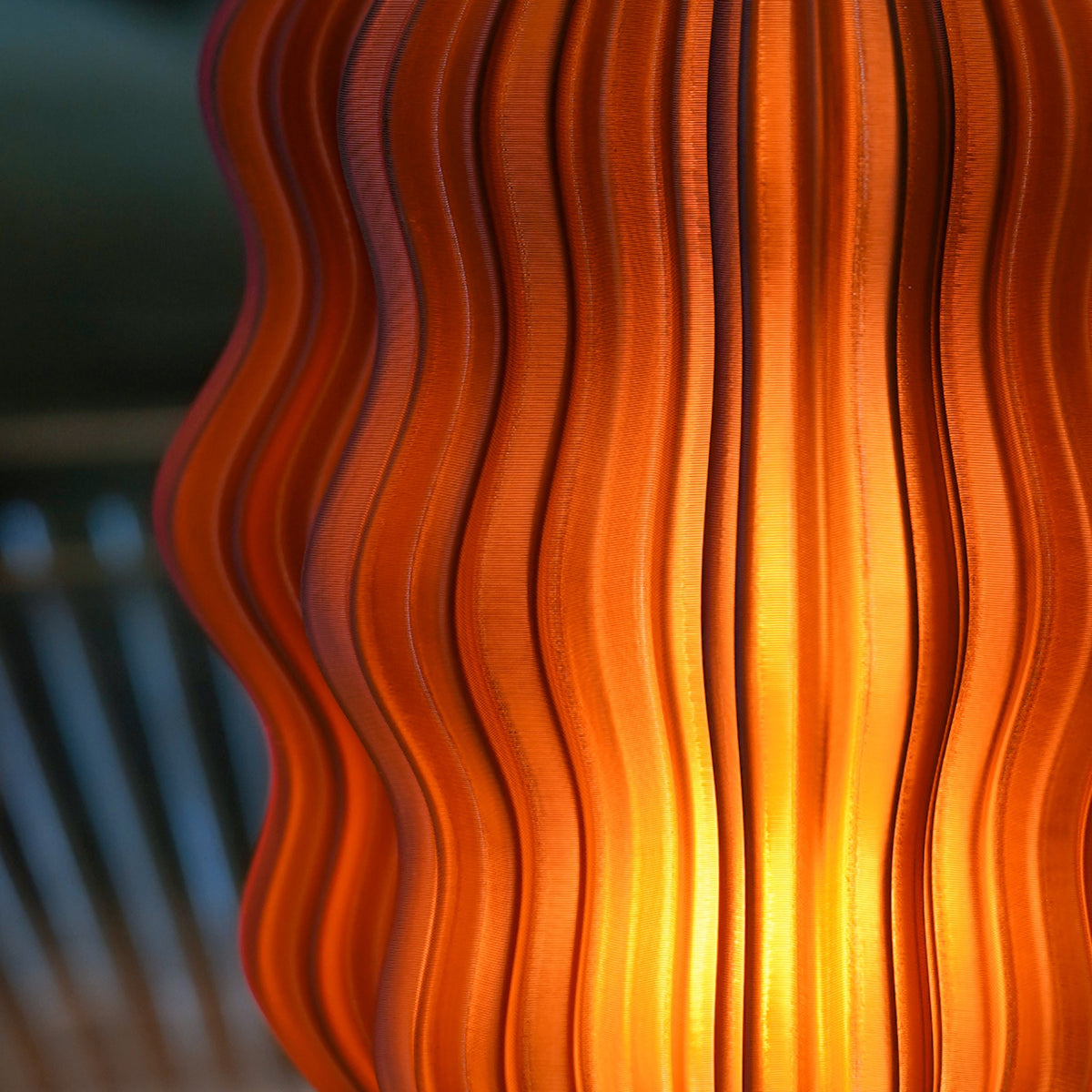 Cordless mini wavy lamp shown in a bedroom setting