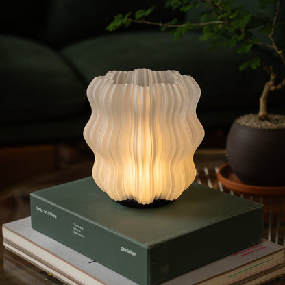 Cordless mini wavy lamp in an alternative finish option