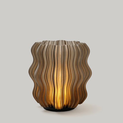 Cordless mini wavy lamp shown in a living room setting