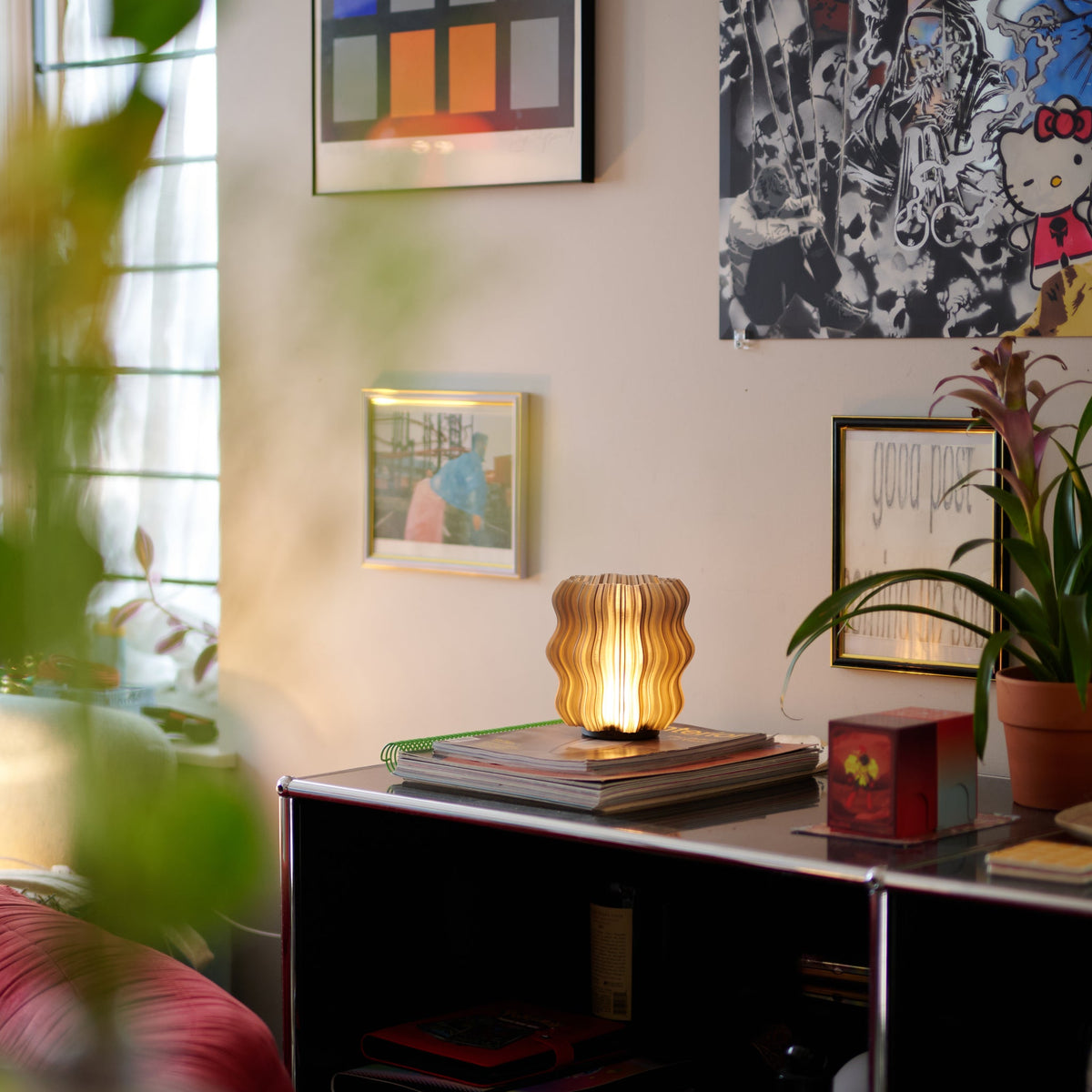Cordless mini wavy lamp shown on a dining table