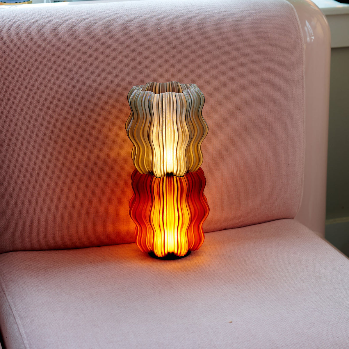 Cordless mini wavy lamp shown on a bedside table