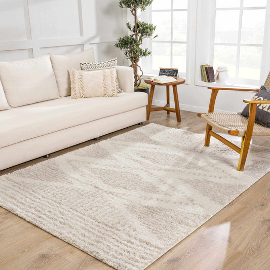 Light beige plush shag area rug shown in a room setting