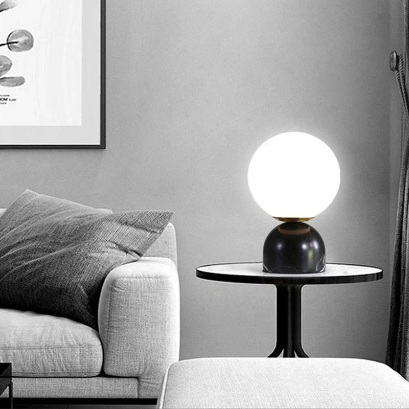 Table lamp lit in living room setting