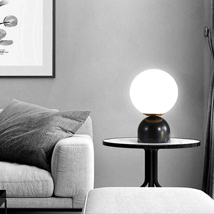 Table lamp lit in living room setting