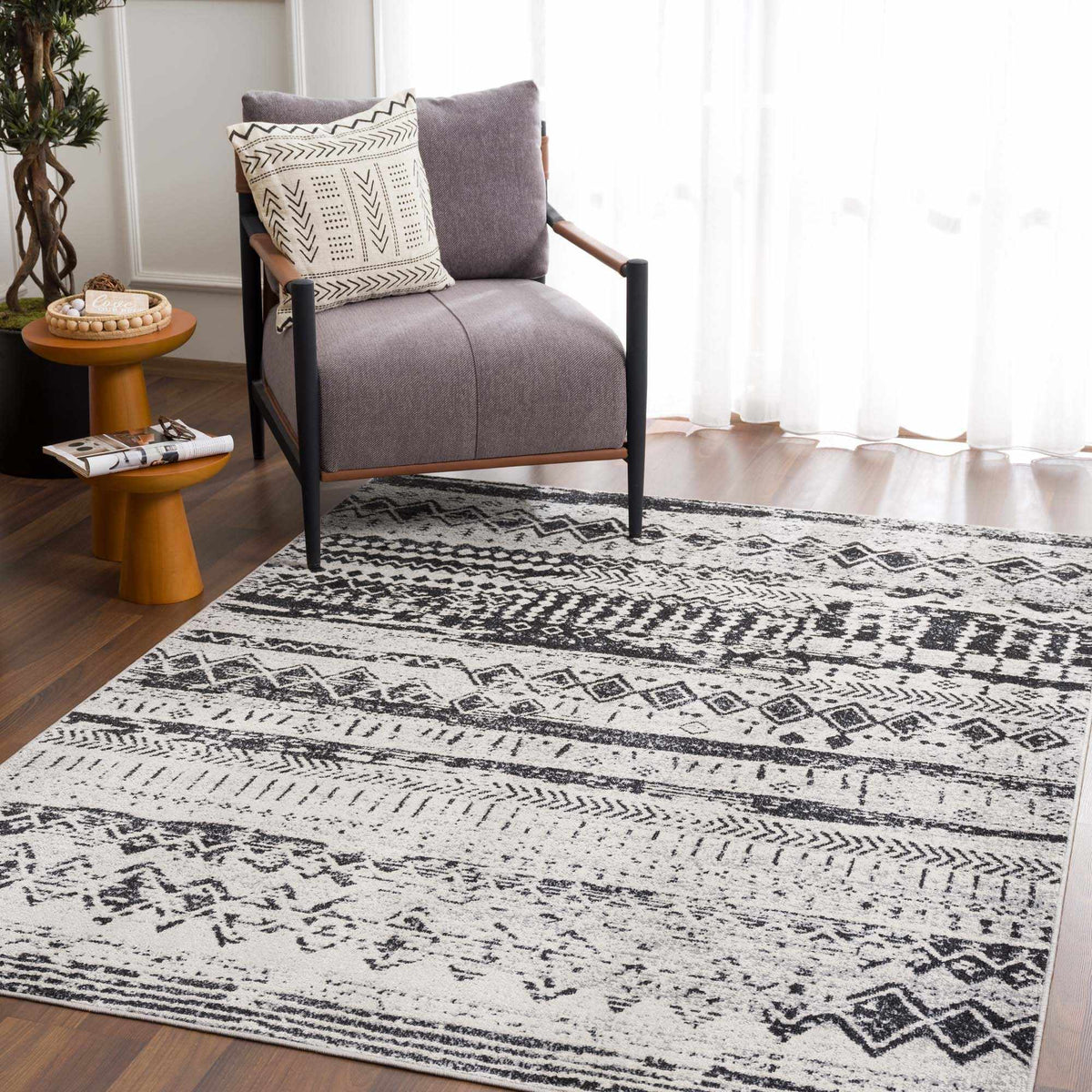 Black and gray washable area rug shown in a room setting