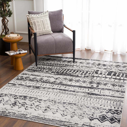 Black and gray washable area rug shown in a room setting