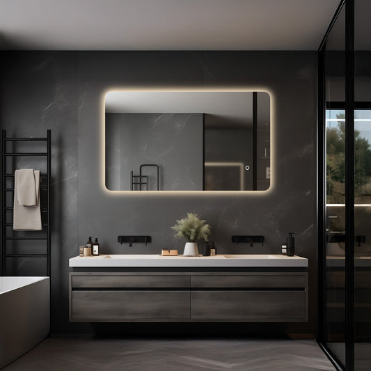 Frameless backlit LED mirror shown above a vanity in a bathroom