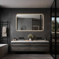 Frameless backlit LED mirror shown above a vanity in a bathroom