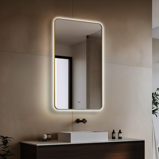 Brushed gold LED bathroom mirror shown above a vanity in a bathroom