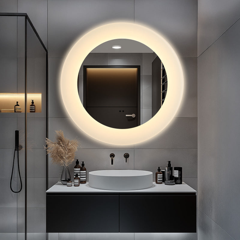 Round LED bathroom mirror mounted above sink