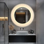 Round LED bathroom mirror mounted above sink