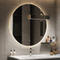 Backlit bathroom mirror installed above vanity