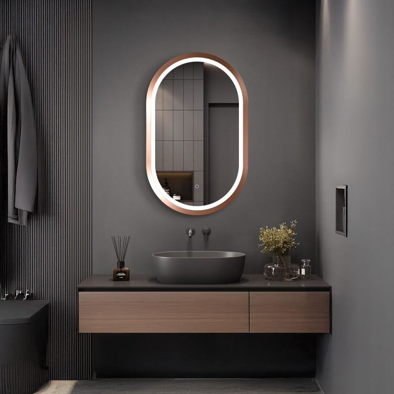 Oval rose gold LED mirror shown above a vanity in a bathroom