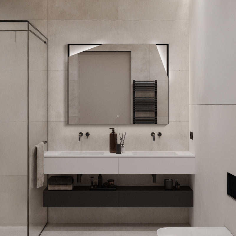 LED mirror with irregular cutout design above vanity