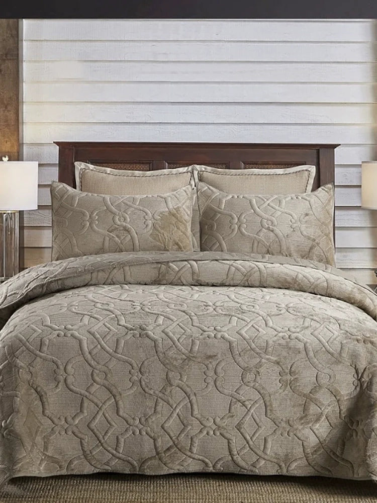 Quilted flannel bedspread set styled on a bed with two pillowcases