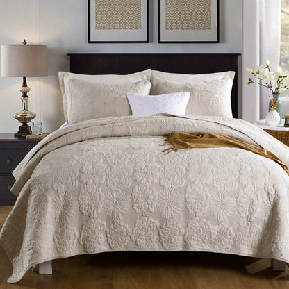 Cotton quilted bedspread set styled on a bed with two pillowcases