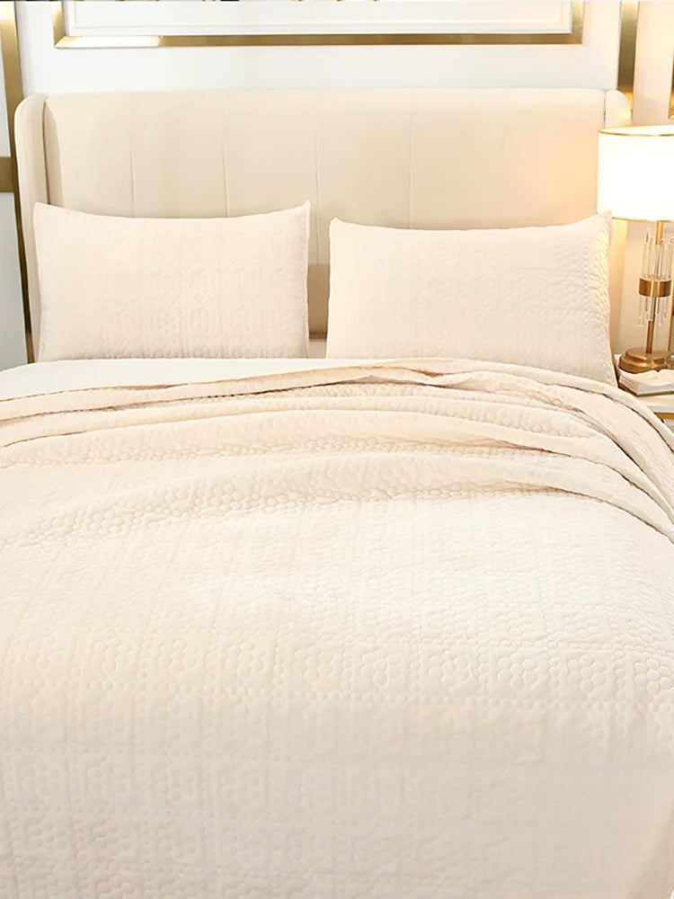 Flannel bedspread folded to show both fabric sides