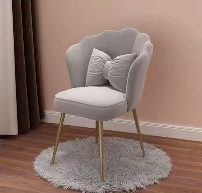 Matching Nordic style stool shown beside the chair