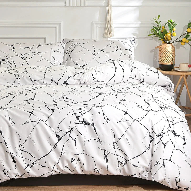 Black and white duvet cover set styled on a bed with matching pillowcases