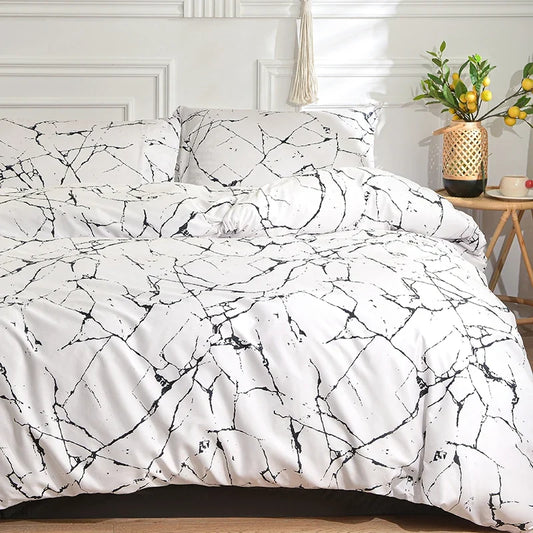Black and white duvet cover set styled on a bed with matching pillowcases