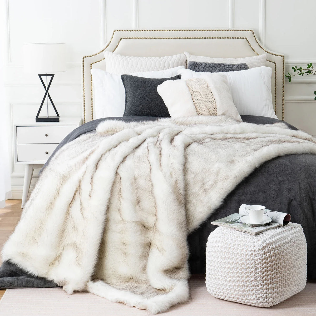 Faux fur throw draped over sofa