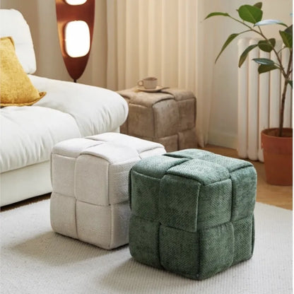 Upholstered woven bench stool in entryway