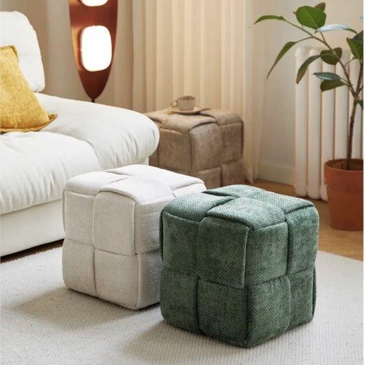 Upholstered woven bench stool in entryway