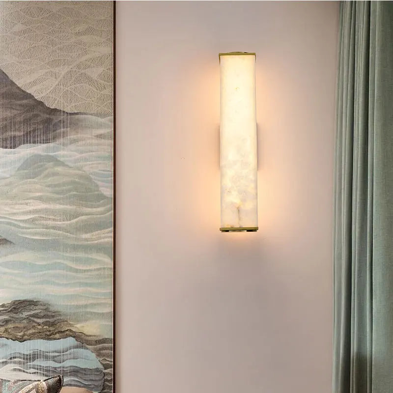 Close-up of marble detail on gold wall sconce