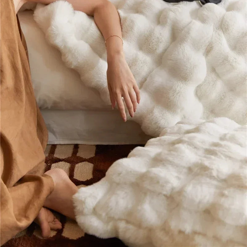 Faux fur blanket folded on sofa