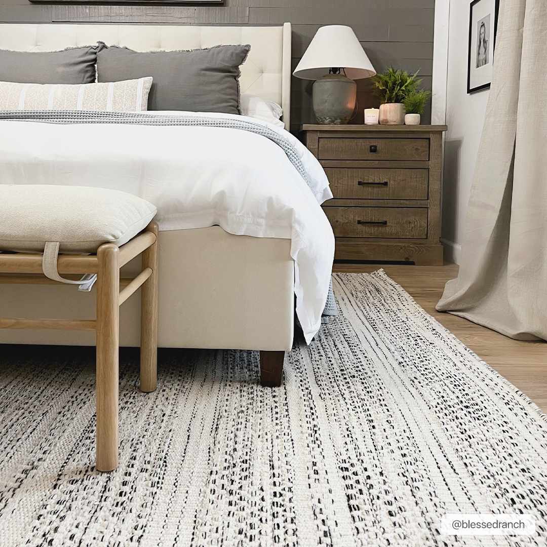 Flatweave wool rug photographed flat against a plain background