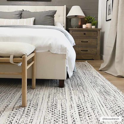Flatweave wool rug photographed flat against a plain background