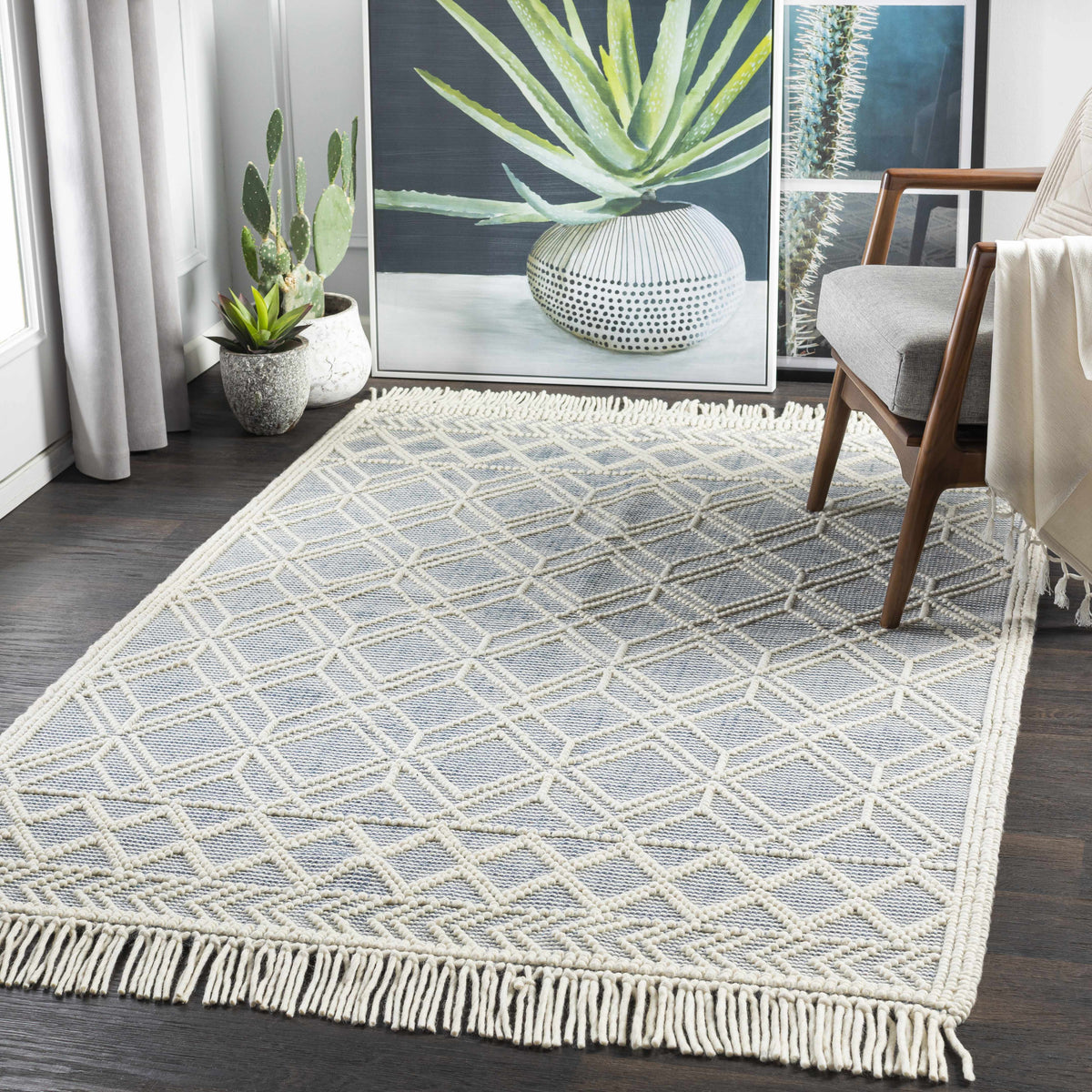 Hand woven trellis rug photographed flat against a plain background