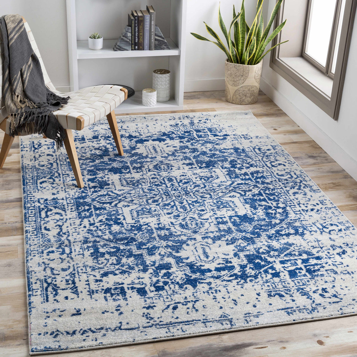 Navy and gray vintage pattern area rug shown in a room setting