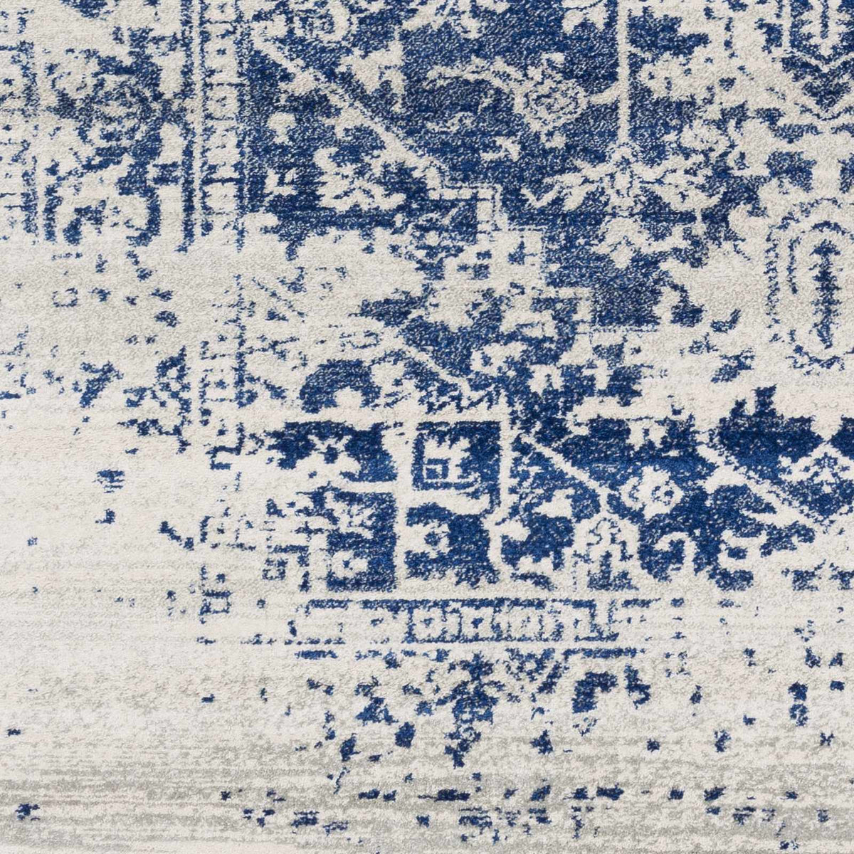 Close view of the faded medallion pattern and medium pile