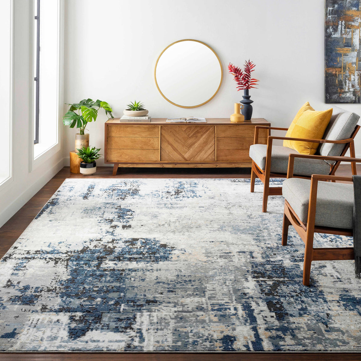 Blue and gray abstract area rug shown in a room setting